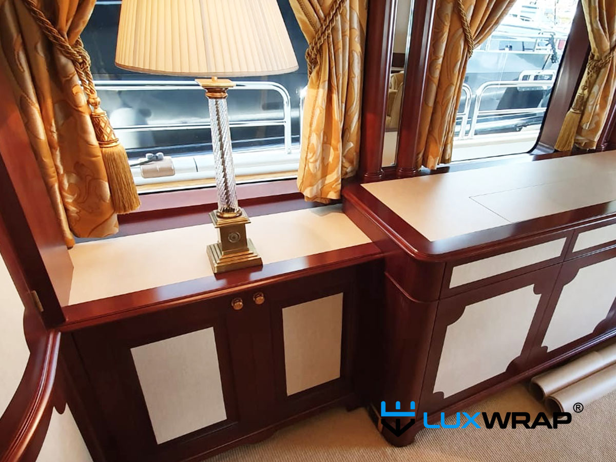 Partial interior wrap of yacht cupboard door faces and worktops — refreshing a dated interior without a full refit