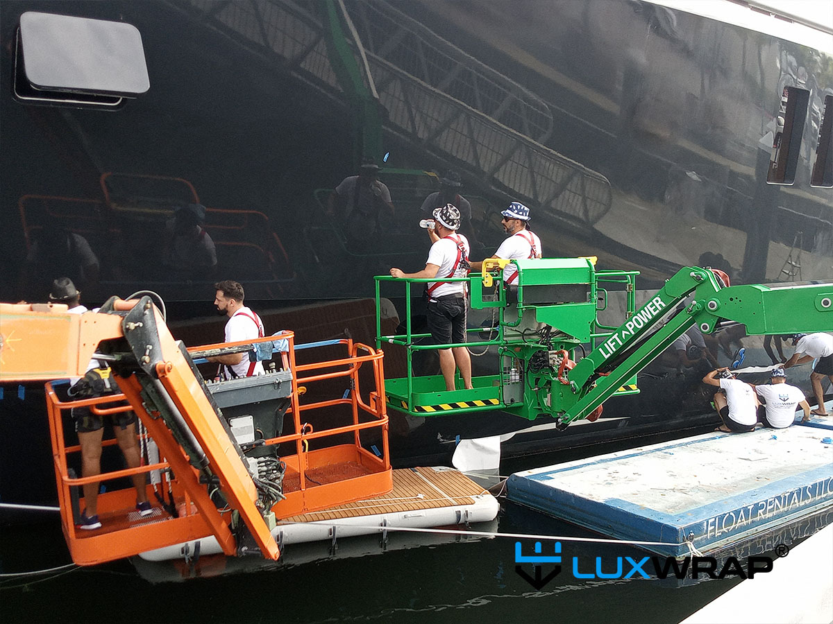 LuxWrap installers prepare to wrap 68 meter superyacht hull