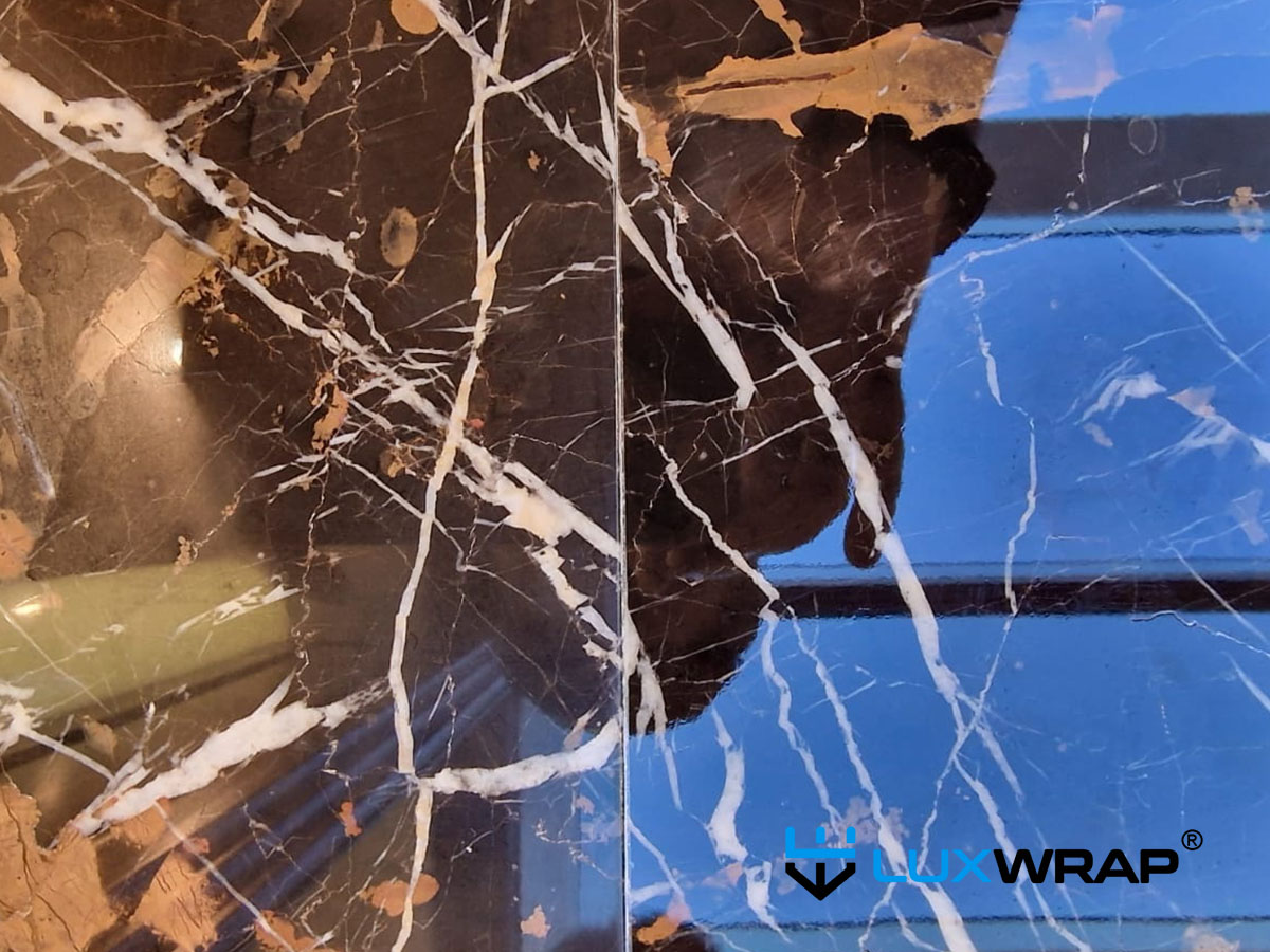 LuxWrap installed NinjaShield Gloss on marble, protecting against abrasion, stains and increasing gloss level. 
