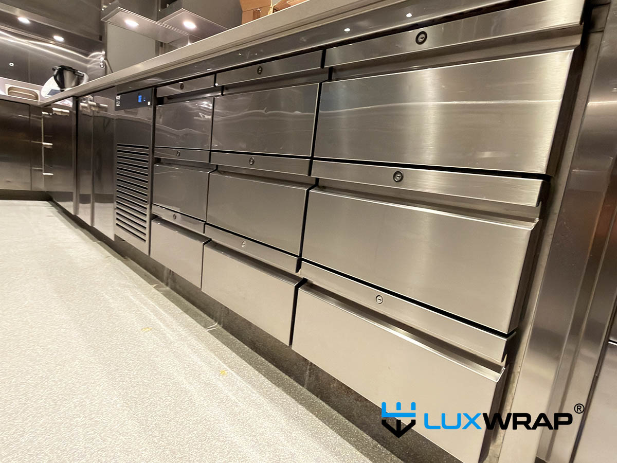 New-build yacht galley completely wrapped high gloss PPF surface and paint protection film