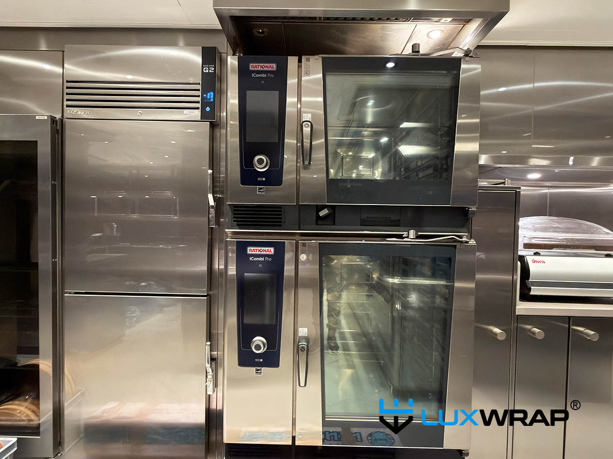 New-build yacht galley completely wrapped high gloss PPF surface and paint protection film