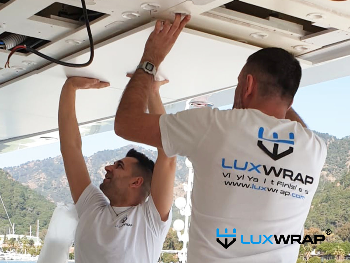 Superyacht deckhead panels removed in preparation for wrapping rather than sending to a paint shop