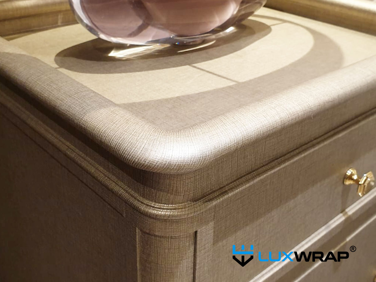 Yacht furniture fully wrapped with 3M DI-NOC architectural film by LuxWrap — professional installation on complex furniture pieces