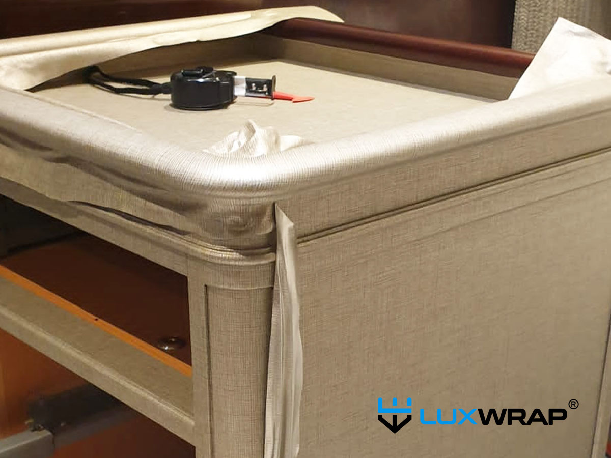 Superyacht bedside table wrapped with architectural vinyl film by LuxWrap