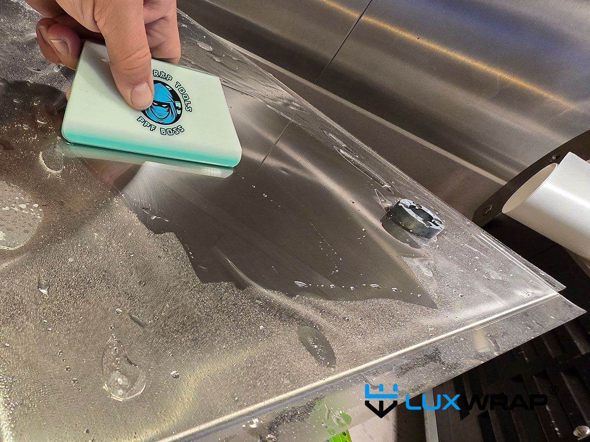 LuxWrap installation of NinjaShield Gloss PPF in superyacht galley.