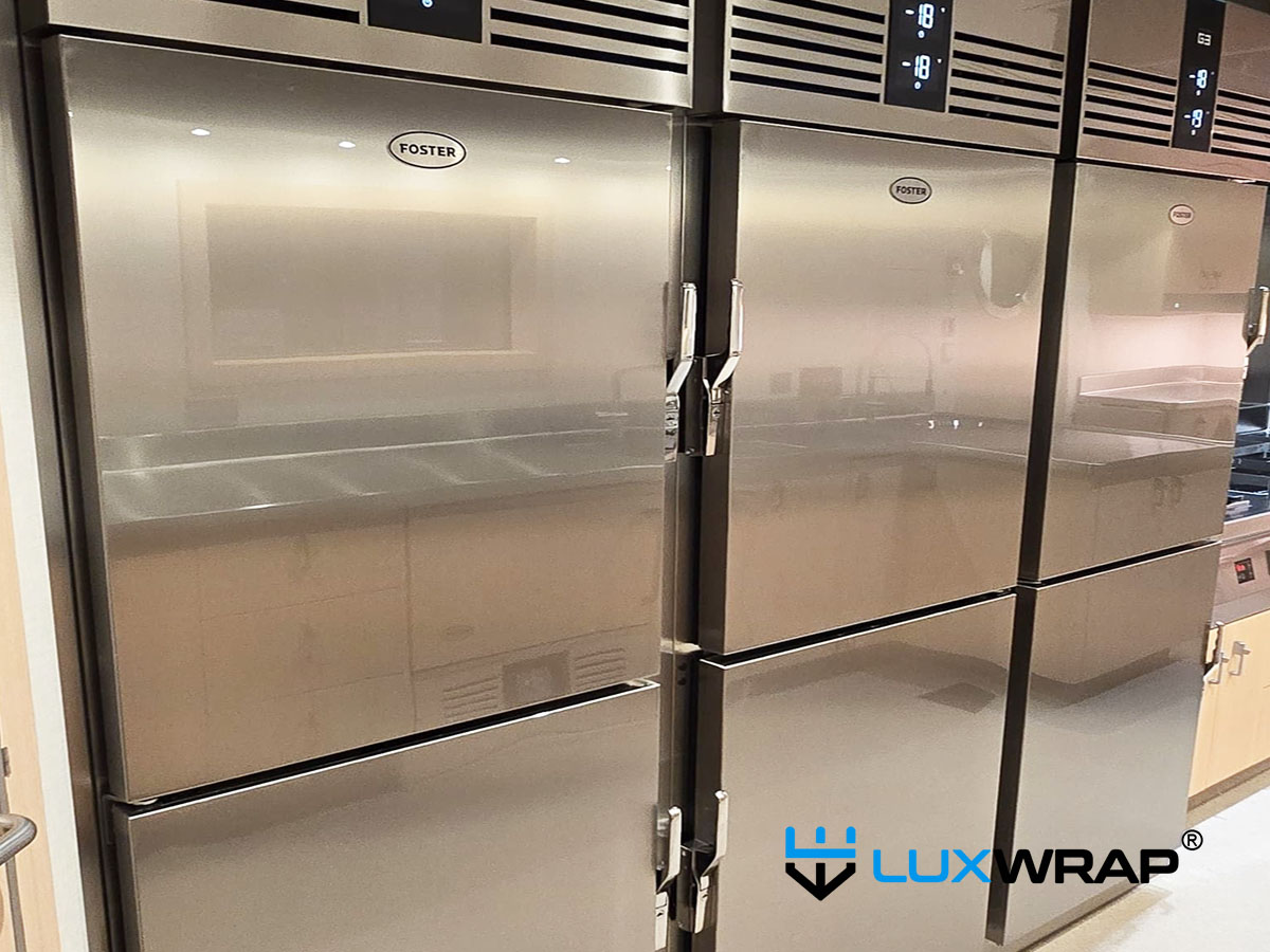 Completed superyacht galley refrigerator wrapped in NinjaShield Gloss PPF, delivering a flawless high-gloss finish with hydrophobic and self-healing protection against scratches and abrasion.