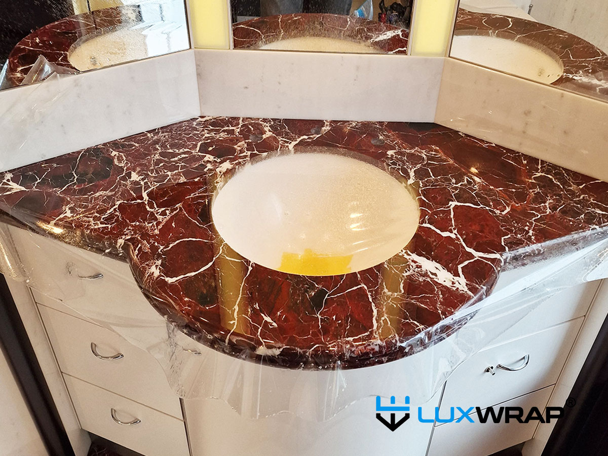 LuxWrap installed NinjaShield Gloss on marble superyacht sink, protecting against abrasion, stains and increasing gloss level significantly. 